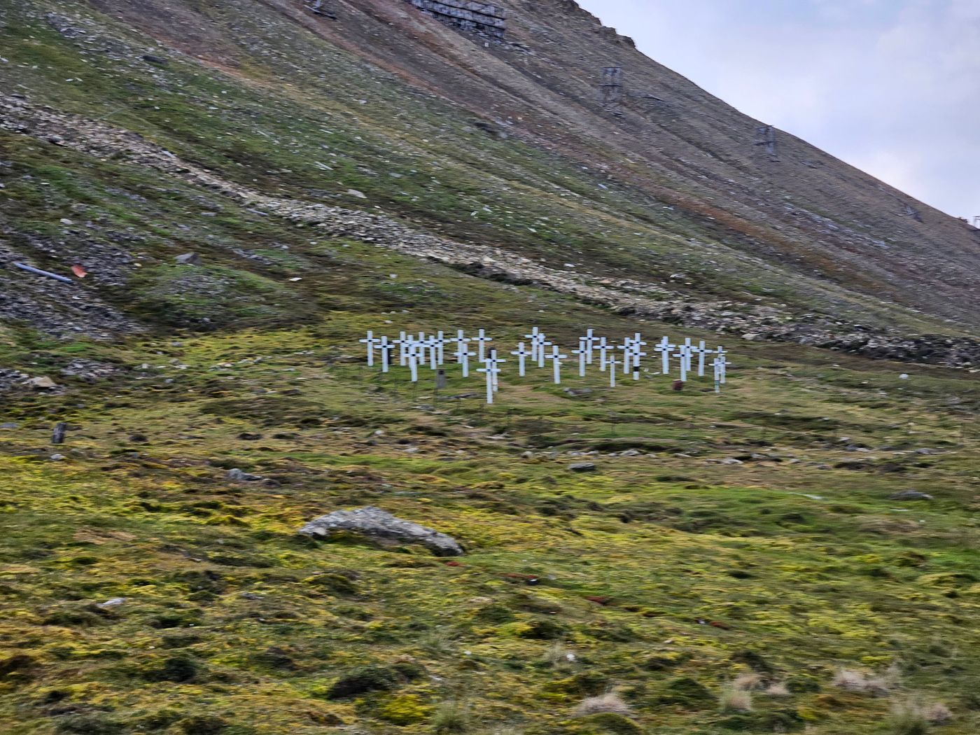 The white crosses of the old cemetery on the hillside