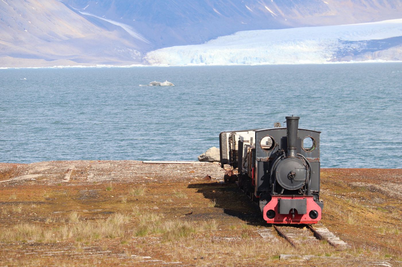 The old locomotive still sits out on the tundra