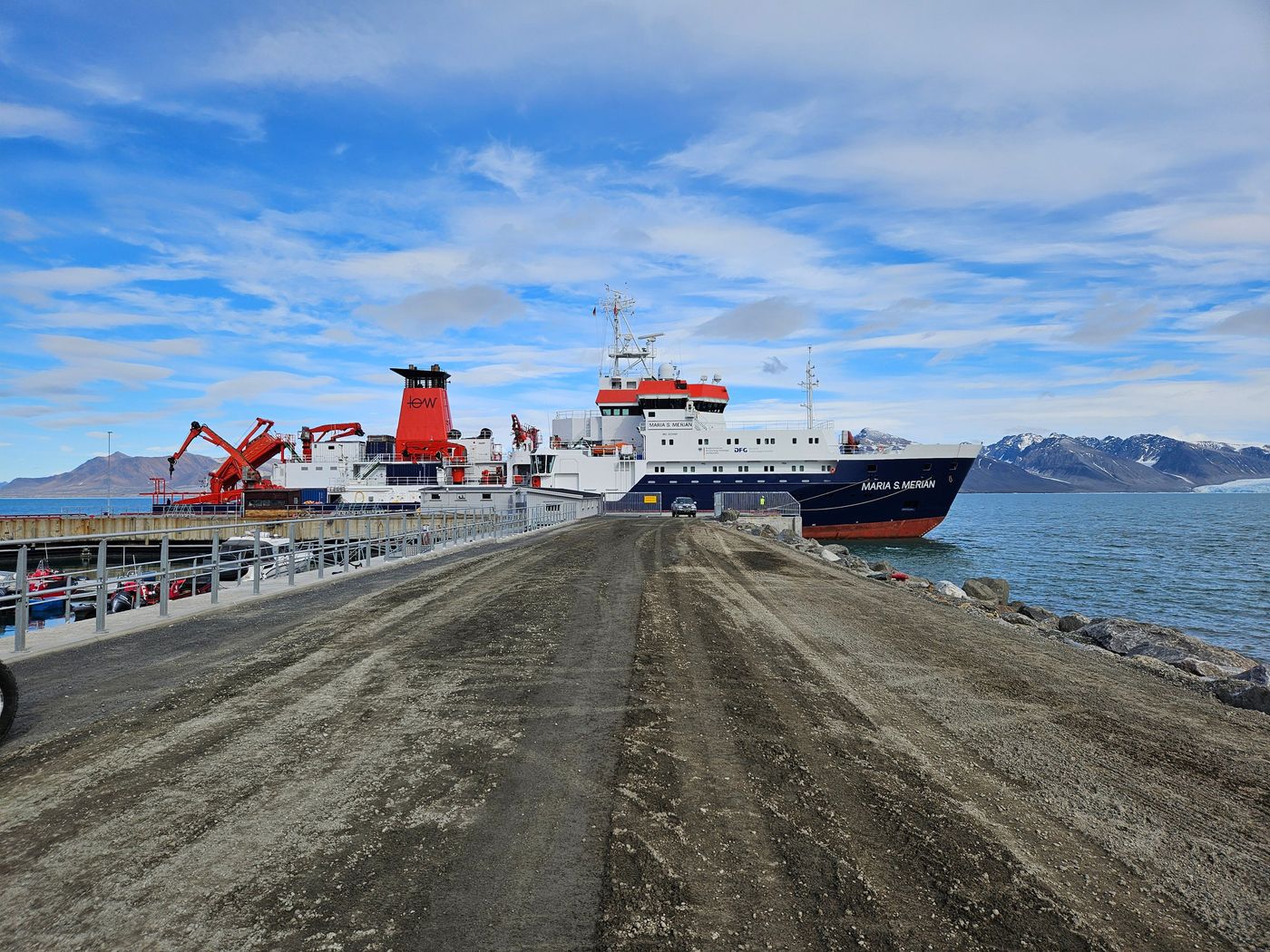 The Merian down the causeway, glacier over her bow