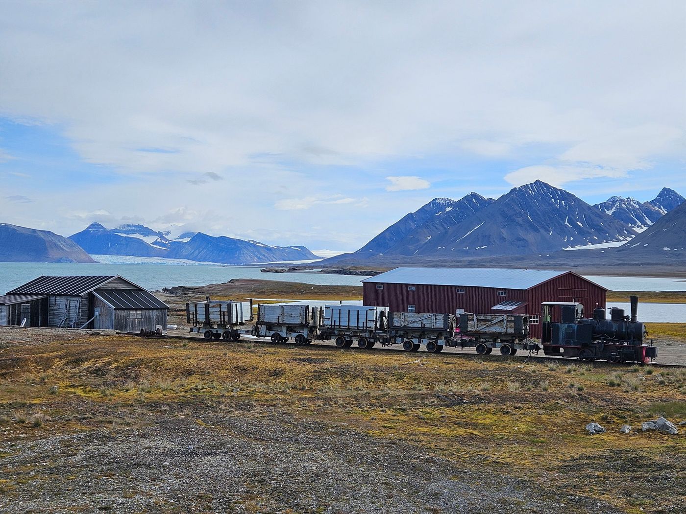The coal train, the sheds and the mountains behind