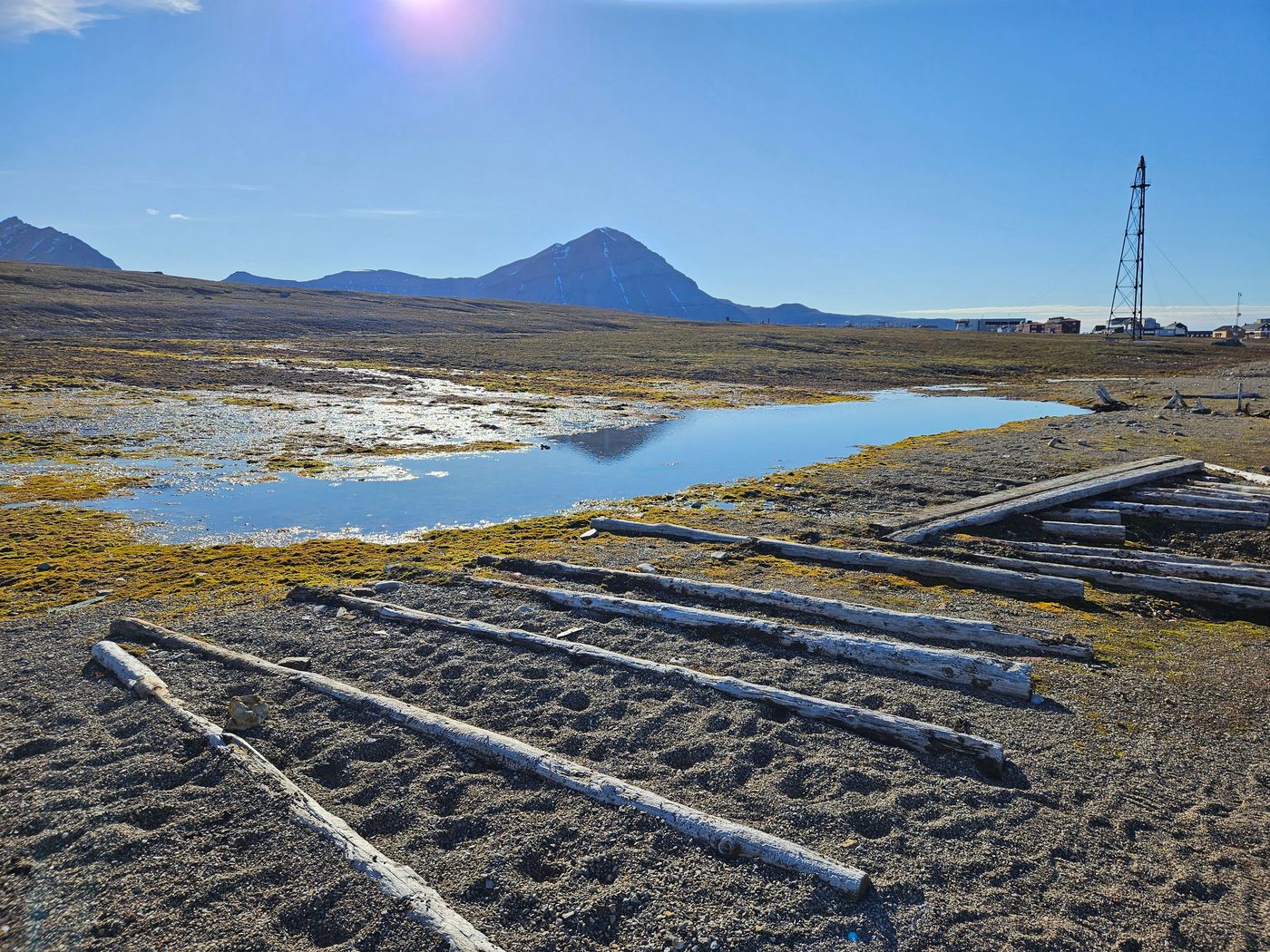 Collapsed coal trestle beams laid out on the tundra