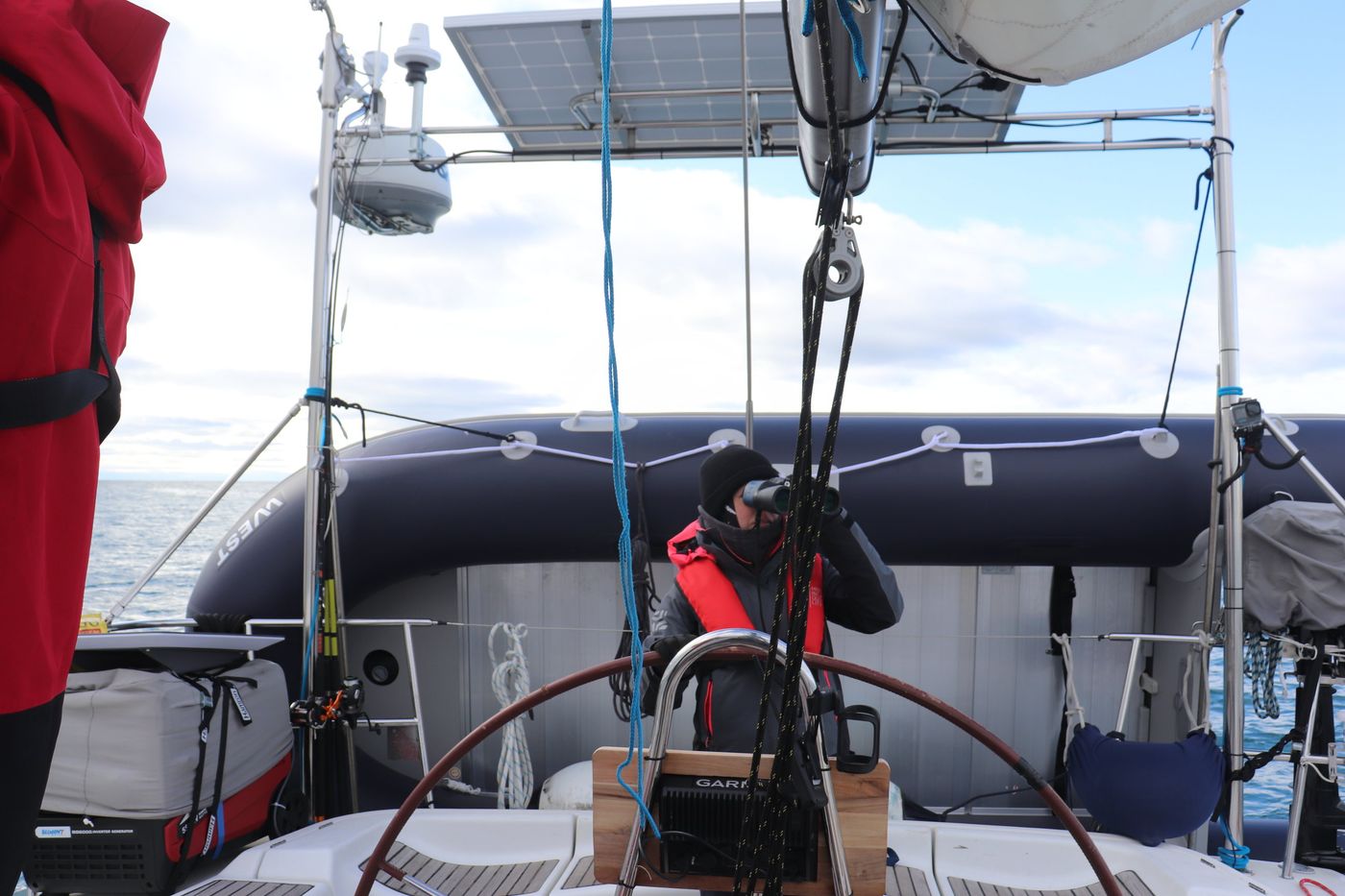 At the wheel, radar and solar panels overhead