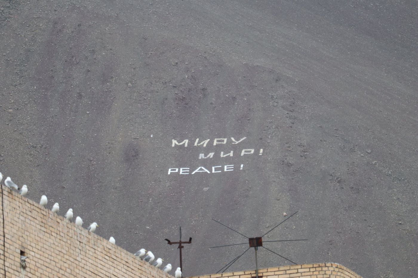 Miru Mir! PEACE! laid in stones on the black slope
