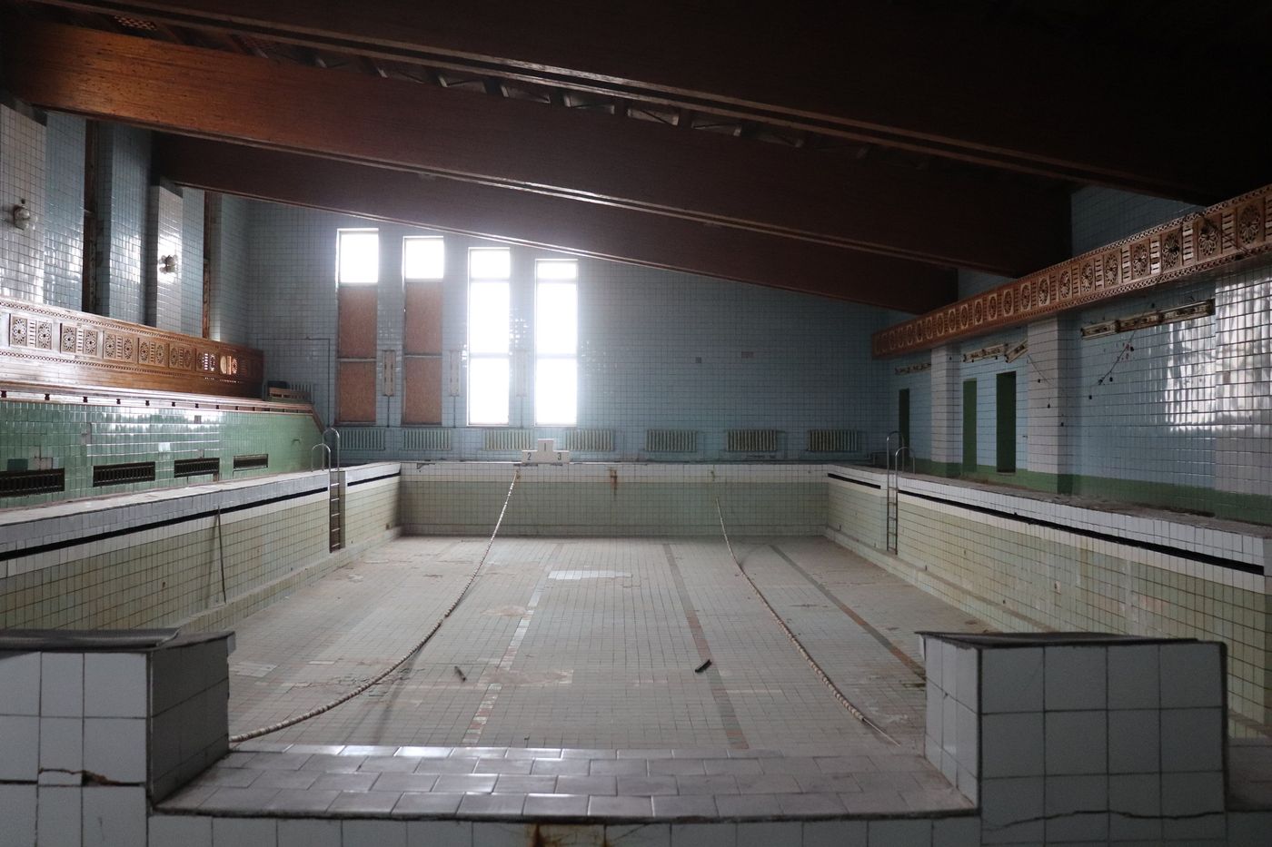 The drained pool, tiles and lane lines still in place