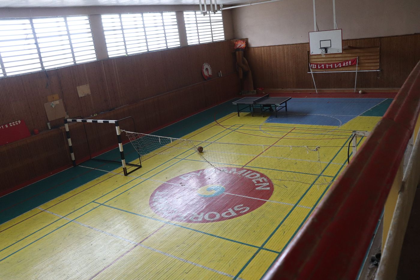 Painted lines and a Soviet crest on the gym floor