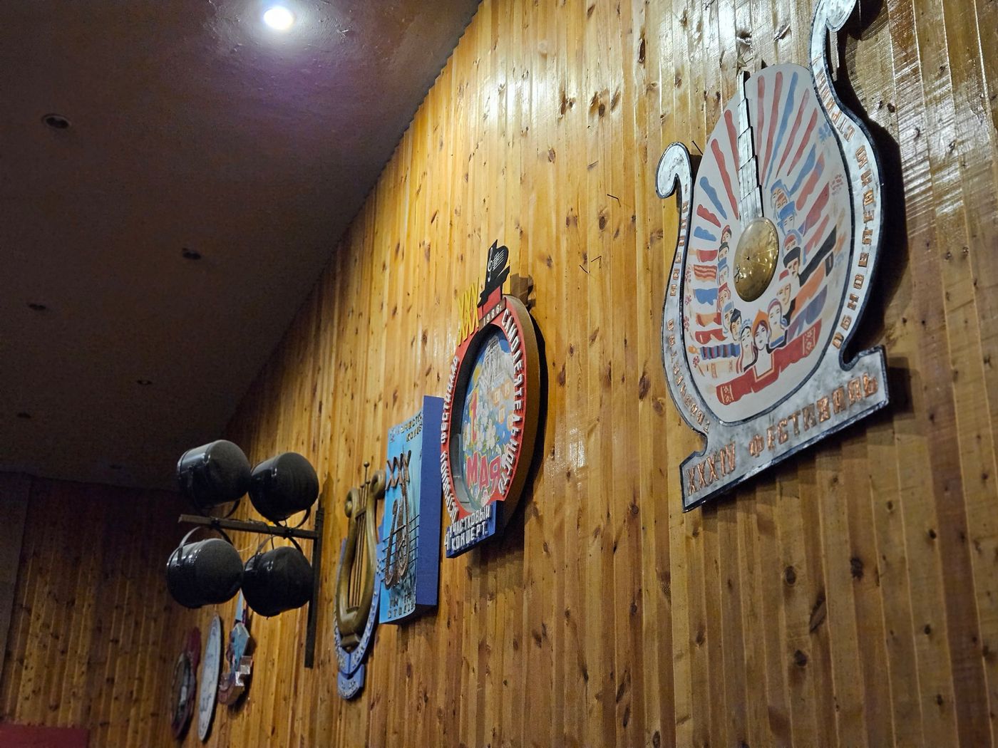 Crests of the Soviet republics on the pine wall