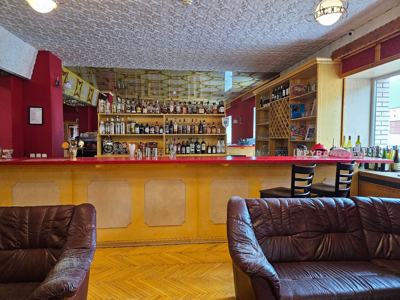 A stocked bar, still open in a town that closed