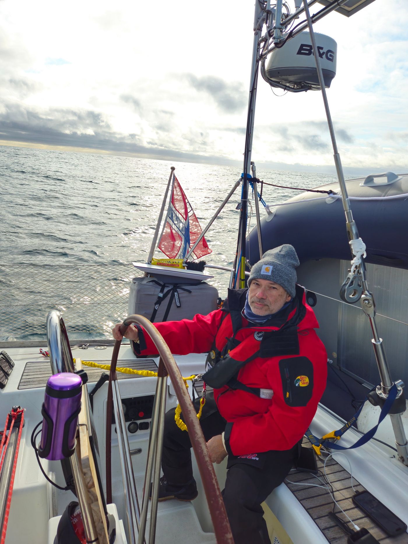 Two up at the wheel, hand steering the passage
