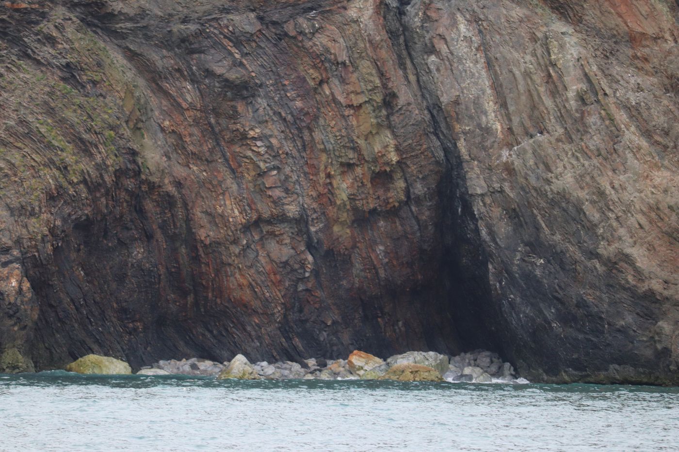 Sea cave chewed into the base of the bird cliff
