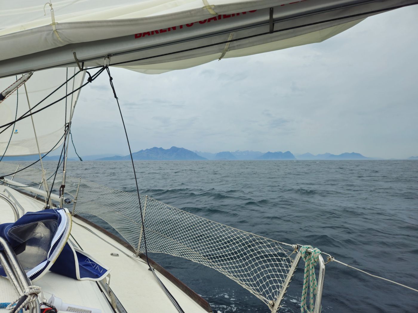 Norwegian mainland rises over the guardrail