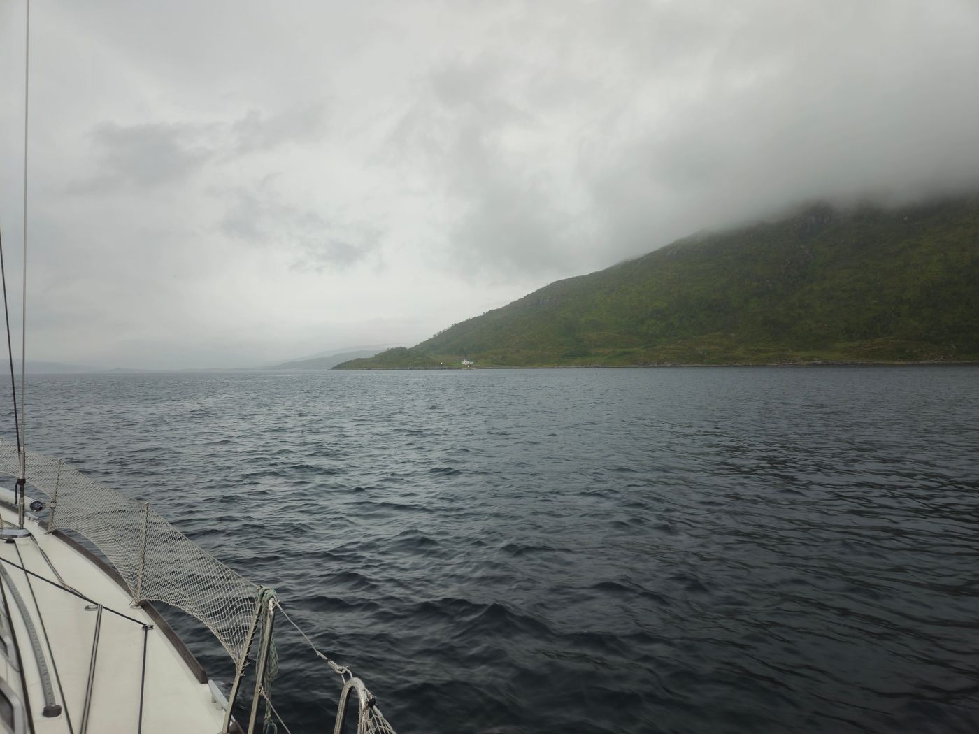 Green headland and flat water on the run in