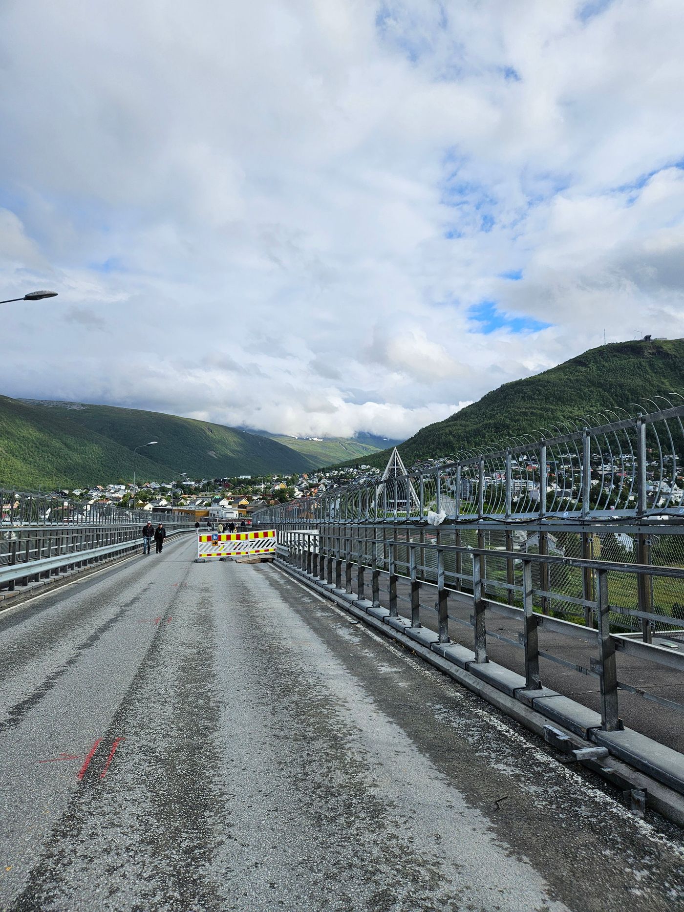 Crossing the Tromso bridge on foot, the town below
